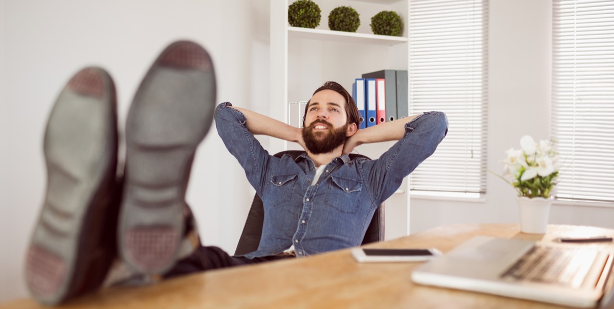 man propped up feet